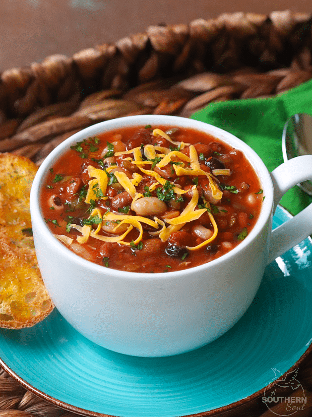 15 Bean Soup made with protein packed bean cooked in vegetable stock with crushed tomatoes, onions, garlic and seasonings is a bowl full of comfort!
