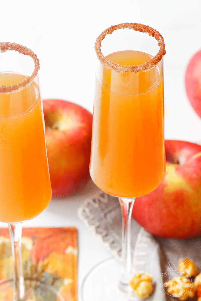 Apple Cider Mimosas made with apple cider and champagne is a simple two ingredient drink that's perfect for celebrating fall!