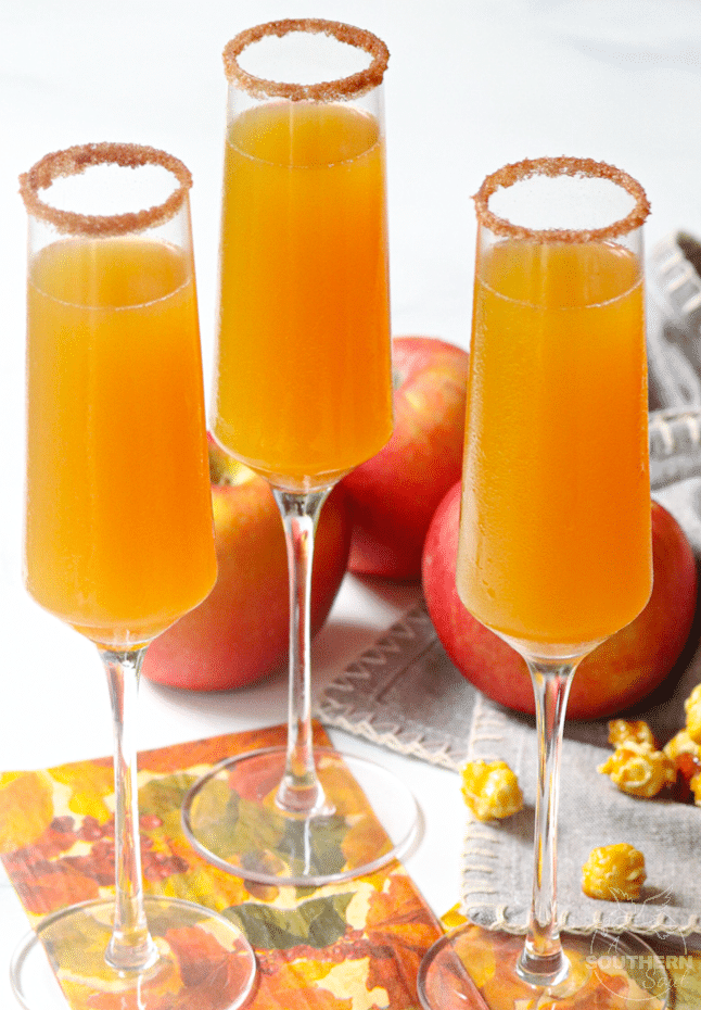Apple Cider Mimosas made with apple cider and champagne is a simple two ingredient drink that's perfect for celebrating fall!