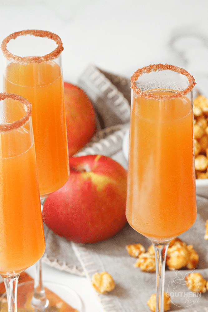 Apple Cider Mimosas made with apple cider and champagne is a simple two ingredient drink that's perfect for celebrating fall!