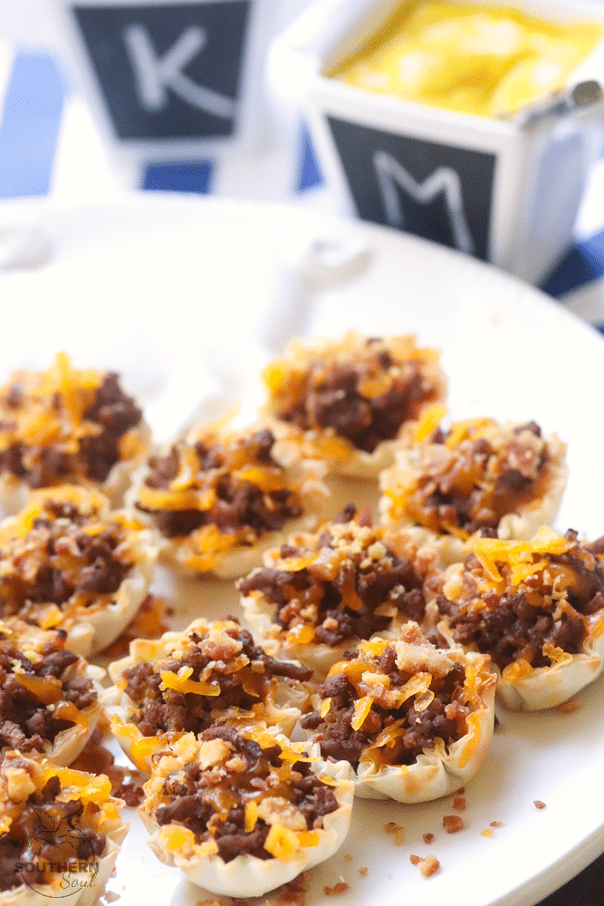 Bacon Cheeseburger Bites made with ground beef, bacon and cheese stuffed phyllo cups are great for parties, tailgating and the perfect bite size snack!