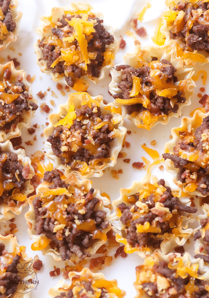 Bacon Cheeseburger Bites made with ground beef, bacon and cheese stuffed phyllo cups are great for parties, tailgating and the perfect bite size snack!