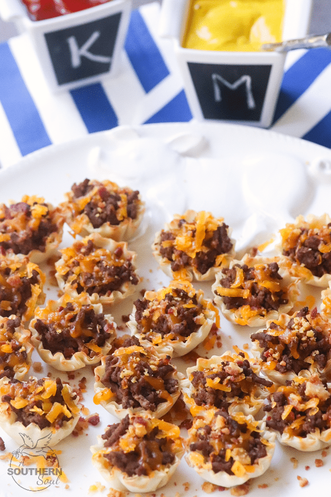 Bacon Cheeseburger Bites made with ground beef, bacon and cheese stuffed phyllo cups are great for parties, tailgating and the perfect bite size snack!