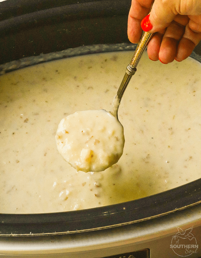 Rich, creamy potato soup made in the crockpot is topped it with cheese, bacon and chives just like a loaded baked potato.