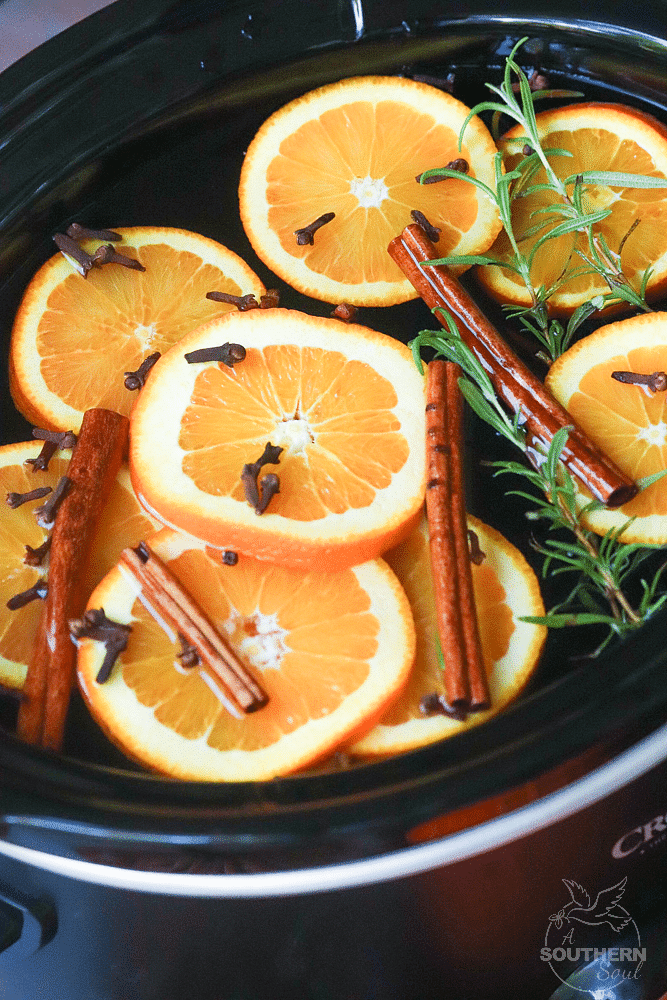 Fall Potpourri made in the crock pot with oranges, cinnamon, clove and rosemary fill your house with beautiful fresh scents.