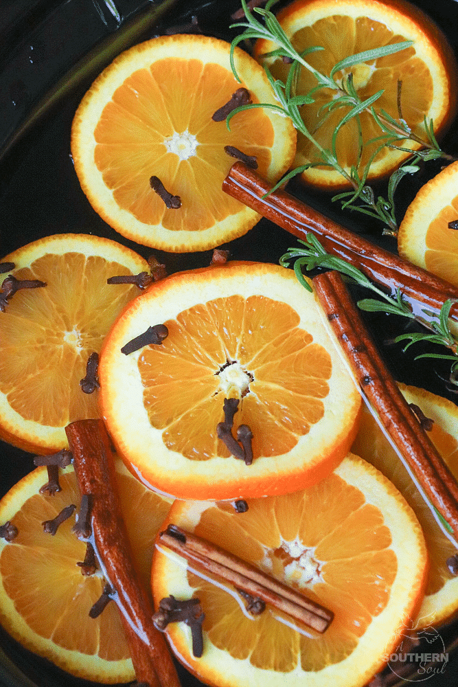 Fall Potpourri made in the crock pot with oranges, cinnamon, clove and rosemary fill your house with beautiful fresh scents.