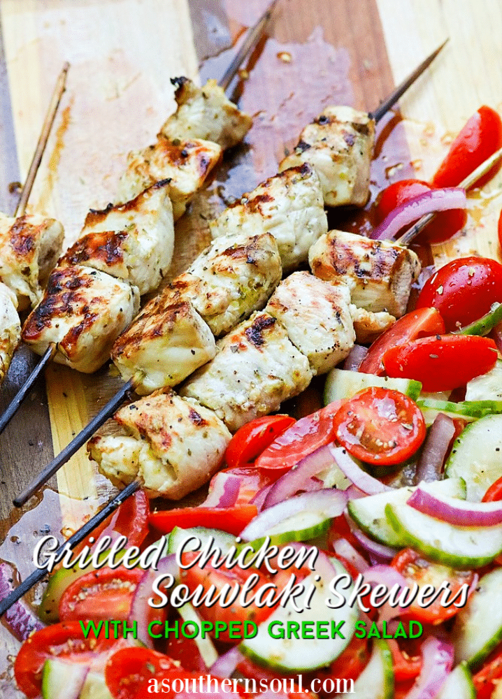 Grilled Chicken Souvlaki Skewers are juicy and tender. Make with lemon juice, oregano, garlic, salt and pepper. Add in a chopped salad with tomatoes, onions and cucumbers and you've got a meal your friends and family will love!