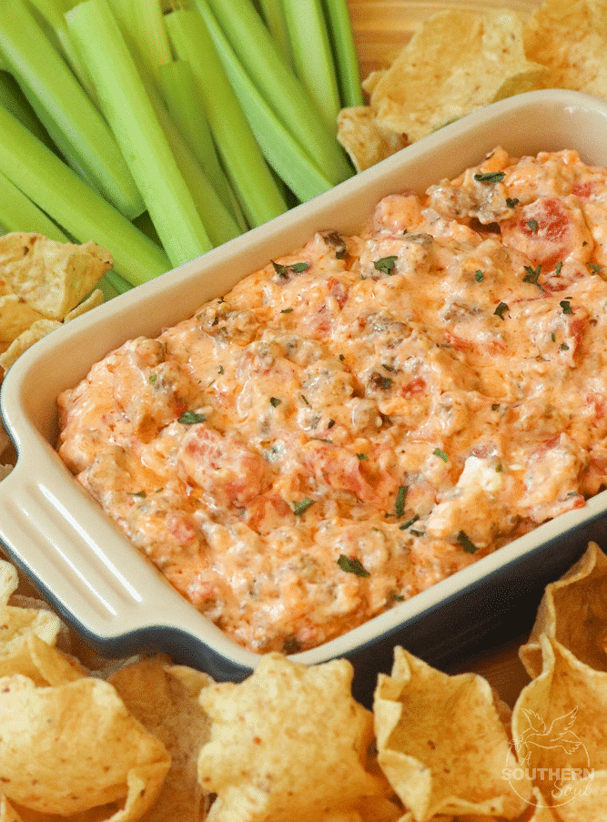 Warm dip made with crumbles sausage, cream cheese, pimento cheese along with green chilies and tomatoes is the perfect dip for parties, game day or tailgating!