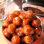 Beefy meatballs, cooked low and slow in the Crock Pot in a sauce made with BBQ sauce, apricot preserves and whole grain mustard are perfect for game day!