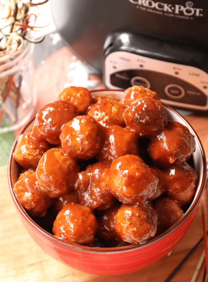 With closer look to this heaping bowl of Game Day Meatballs, you'll notice the rich, tangy, sweet barbeque sauce slathered all over, appearing mouthwateringly irresistible.