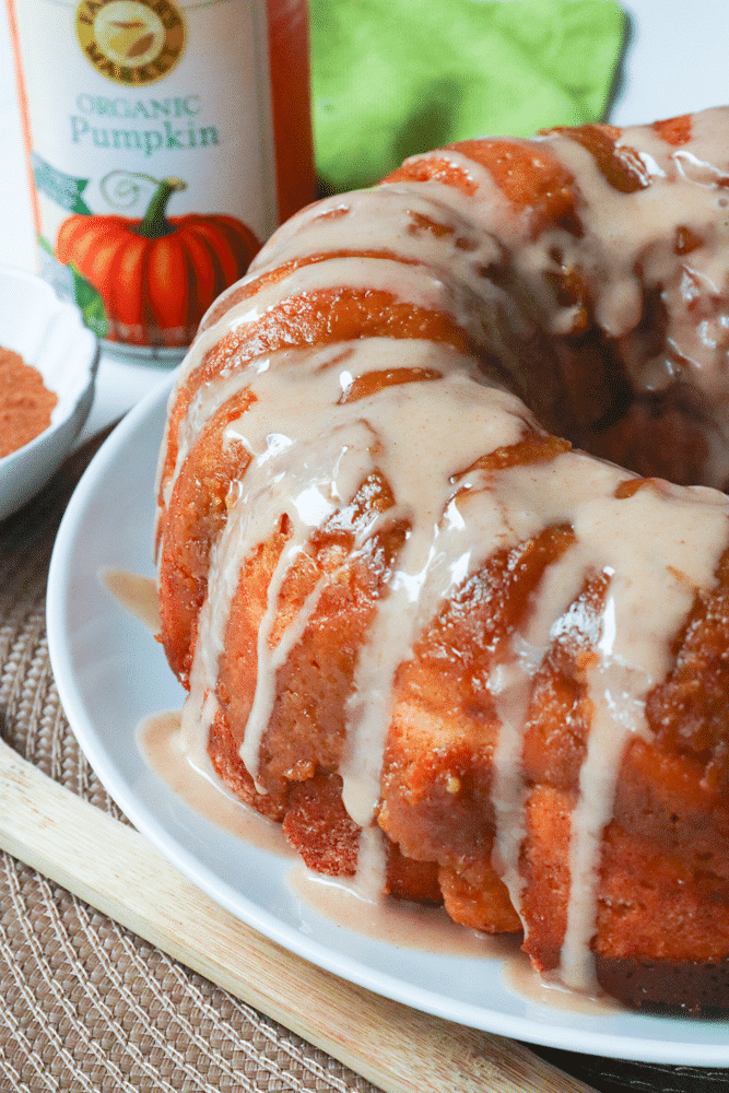 Pumpkin Spice Monkey Bread made with biscuits, spices, cream cheese and pumpkin is a fall treat that's over the top delicious! This easy to make bread is great as a dessert, snack or served for brunch.