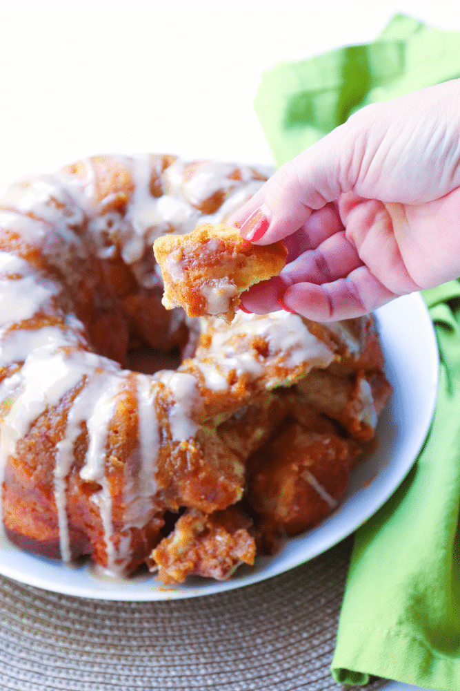 Pumpkin Spice Monkey Bread made with biscuits, spices, cream cheese and pumpkin is a fall treat that's over the top delicious! This easy to make bread is great as a dessert, snack or served for brunch.