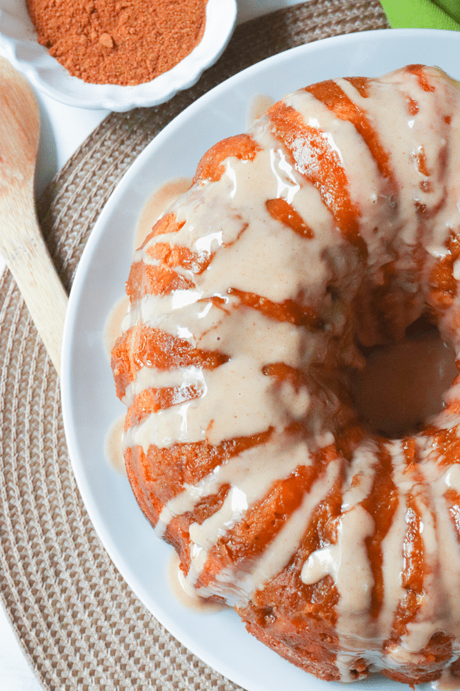 Pumpkin Spice Monkey Bread made with biscuits, spices, cream cheese and pumpkin is a fall treat that's over the top delicious! This easy to make bread is great as a dessert, snack or served for brunch.
