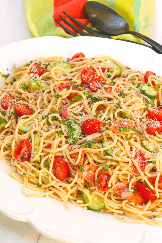 Spaghetti Salad is the perfect side dish for a party, potluck or when you're feeding a crowd. Made with tender pasta, pepperoni, fresh veggies and tossed in a zesty dressing then topped with Parmesan cheese, this easy to make salad is ideal for "soup and salad" night!