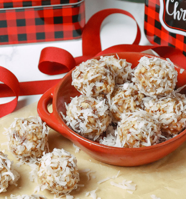 Coconut Date Balls with gift tins are the perfect Christmas treat for friends. A no-bake, easy recipe made with butter, dates, pecans, rice cereal and coconut. This healthy cookie is always a favorite at the holidays.