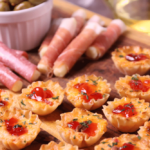 Crispy Phyllo cups filled with pimento cheese then topped with sweet, slightly spicy red pepper jelly makes for delicious appetizer for the holidays, game day or whenever you're entertaining!