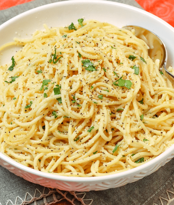 Instant Pot Garlic Parmesan Noodles is comfort food made in 20 minutes. Made with butter, garlic, chicken stock, pasta, Parmesan salt and pepper, this easy recipe is perfect for a week night meal when you've got to get supper on the table in a hurry.