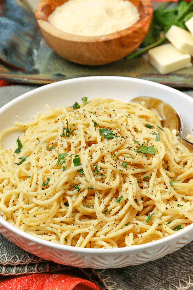 Instant Pot Garlic Parmesan Noodles is comfort food made in 20 minutes. Made with butter, garlic, chicken stock, pasta, Parmesan salt and pepper, this easy recipe is perfect for a week night meal when you've got to get supper on the table in a hurry.