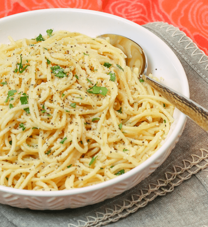 Instant Pot Garlic Parmesan Noodles is comfort food made in 20 minutes. Made with butter, garlic, chicken stock, pasta, Parmesan salt and pepper, this easy recipe is perfect for a week night meal when you've got to get supper on the table in a hurry.