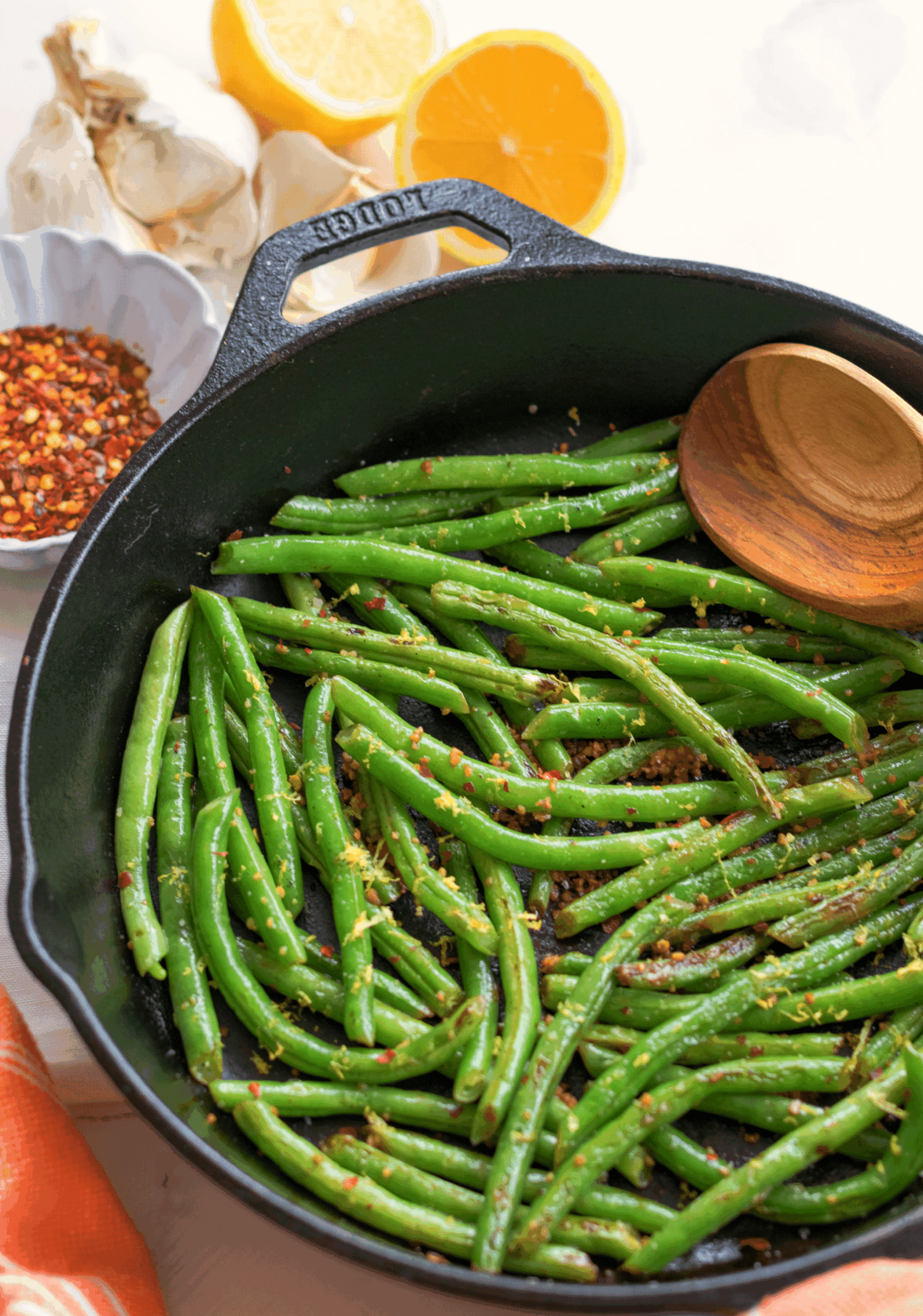 Skillet Green Beans made with garlic, lemon and red pepper is the ideal side dish for any meal! Simple and ready in 15 minutes!