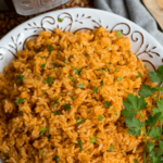 Instant Pot Mexican Rice made with white rice, tomato sauce, onions, cumin and chili powder is a great side dish for a weeknight meal or your next fiesta!