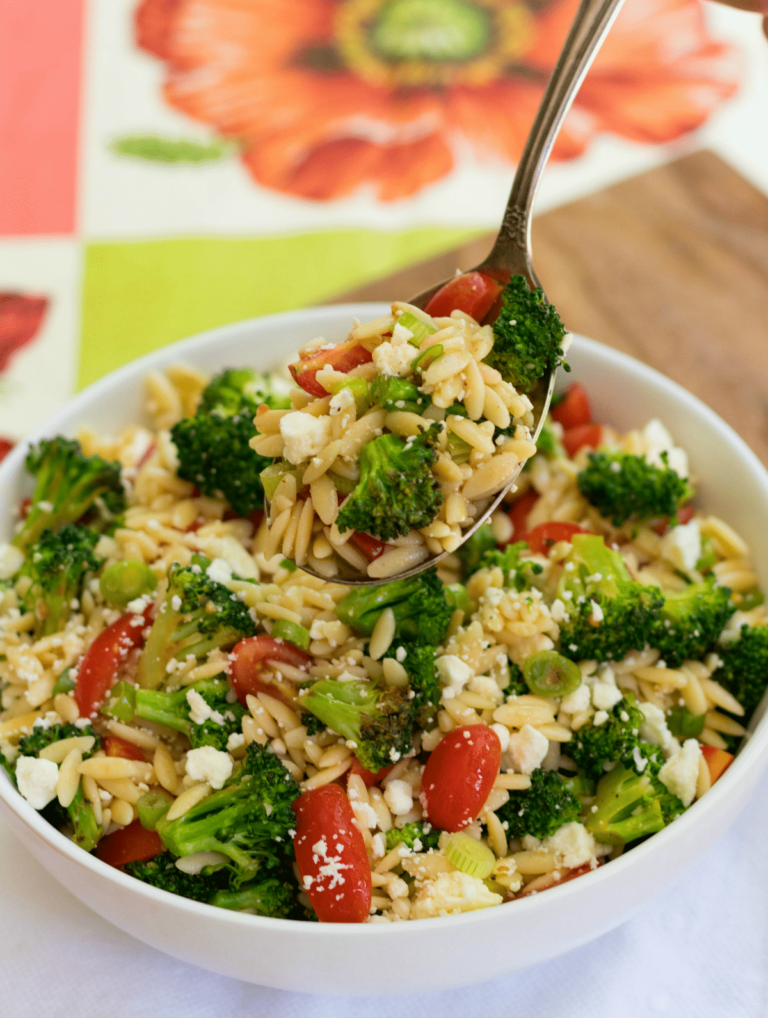 Broccoli Pasta Salad is fresh, flavorful and easy to make! Orzo pasta, broccoli, grape tomatoes, green onion and, feta cheese toss in a light oil and vinegar dressing.