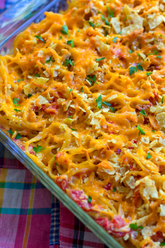 A delicious, easy to make casserole with spaghetti, chicken, Rotel tomatoes and chilie, cream cheese, sour cream and cheddar cheese. A great dish for potlucks, covered dish suppers or when you're feeding a crowd!