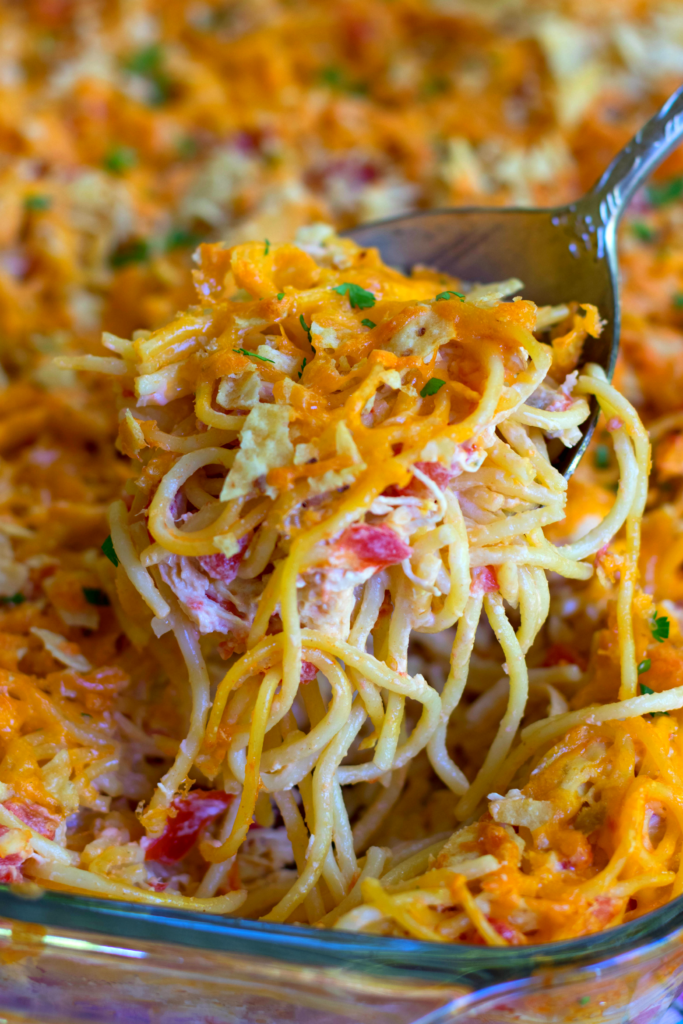 A delicious, easy to make casserole with spaghetti, chicken, Rotel tomatoes and chilie, cream cheese, sour cream and cheddar cheese. A great dish for potlucks, covered dish suppers or when you're feeding a crowd!
