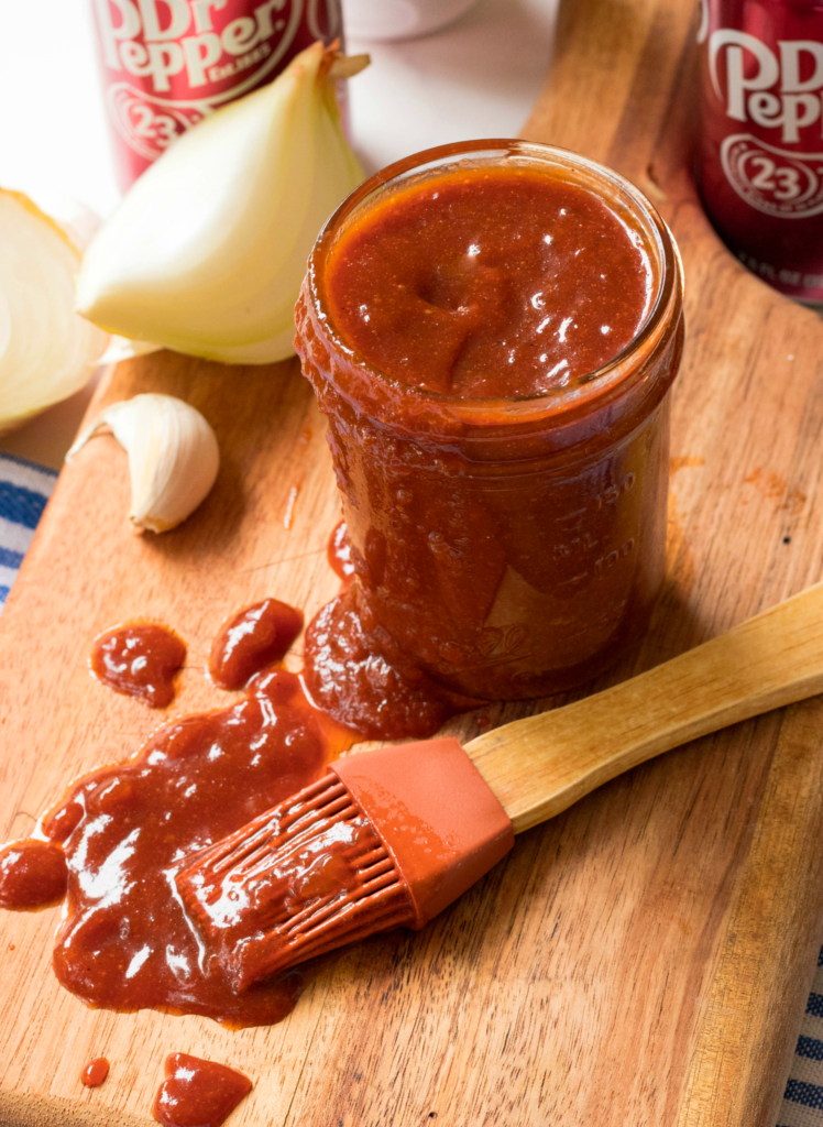 BBQ Sauce made with Dr Pepper soda, brown sugar, honey, ketchup, vinegar, chili powder garlic and tomato paste is so easy to make!