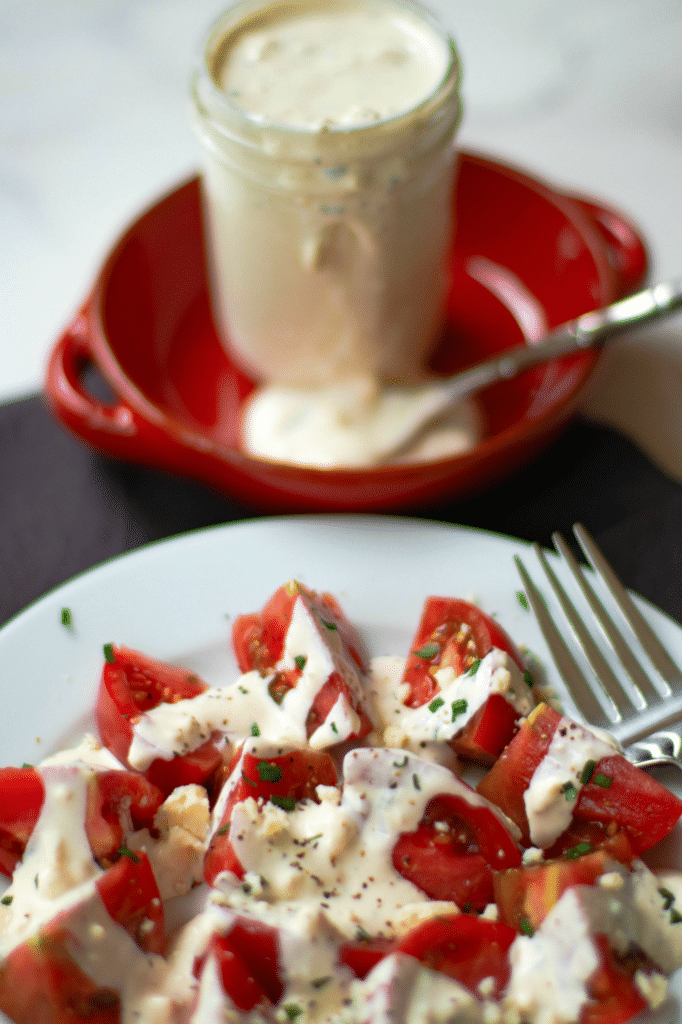 Easy Blue Cheese Dressing made with crumbled blue cheese, sour cream, mayonnaise, garlic powder, cream, chives, salt and pepper is so good! Drizzled it on lettuce for an amazing salad or serve as a dip with fresh veggies.