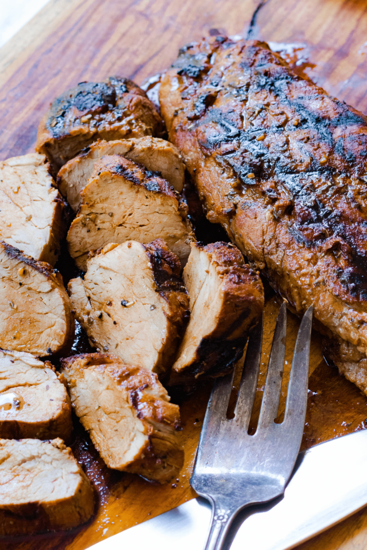 Grilled Pork Tenderloin marinated in olive oil, balsamic vinegar, dried italian seasoning and garlic is tender and juicy. This easy to make recipe is great for a weeknight meal or when you're having guests.