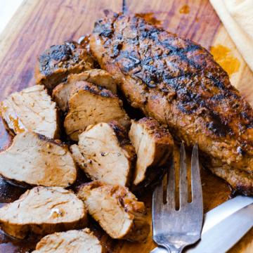 Grilled Pork Tenderloin marinated in olive oil, balsamic vinegar, dried italian seasoning and garlic is tender and juicy. This easy to make recipe is great for a weeknight meal or when you're having guests.