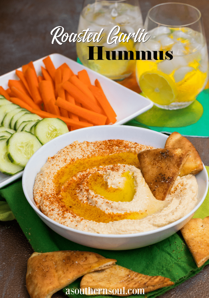 Roasted Garlic Hummus is so delicious and easy to make. Made with olive oil, roasted garlic cloves, chickpeas, lemon juice, tahini, salt and red pepper flakes that are blended together until silky smooth.