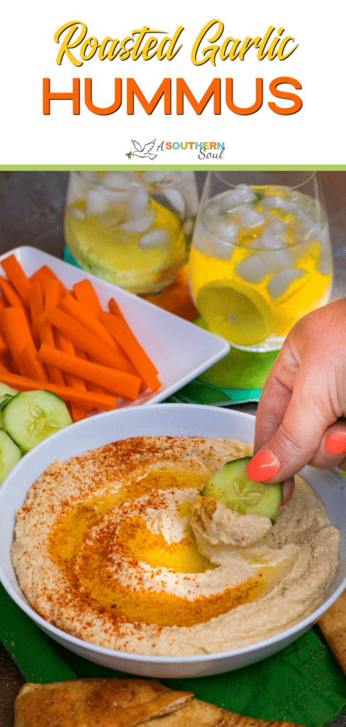 Roasted Garlic Hummus is so delicious and easy to make. Made with olive oil, roasted garlic cloves, chickpeas, lemon juice, tahini, salt and red pepper flakes that are blended together until silky smooth.