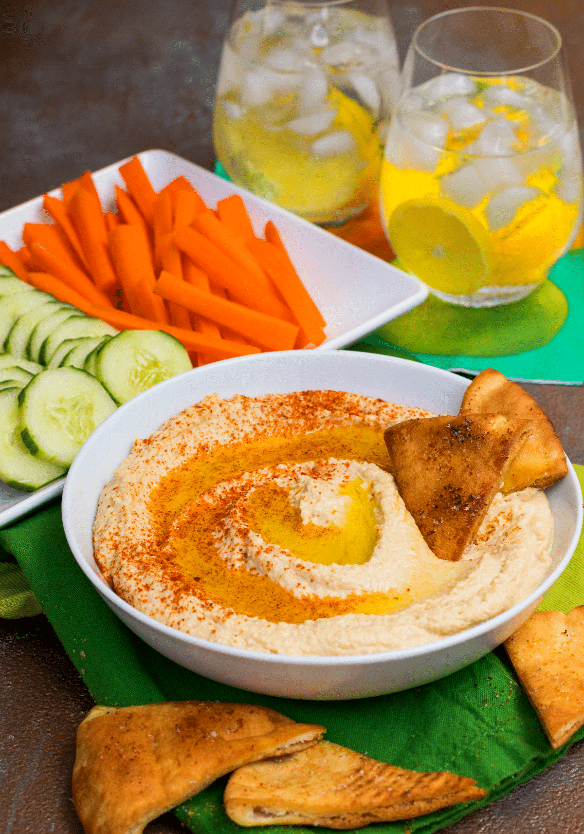 Roasted Garlic Hummus is so delicious and easy to make. Made with olive oil, roasted garlic cloves, chickpeas, lemon juice, tahini, salt and red pepper flakes that are blended together until silky smooth.