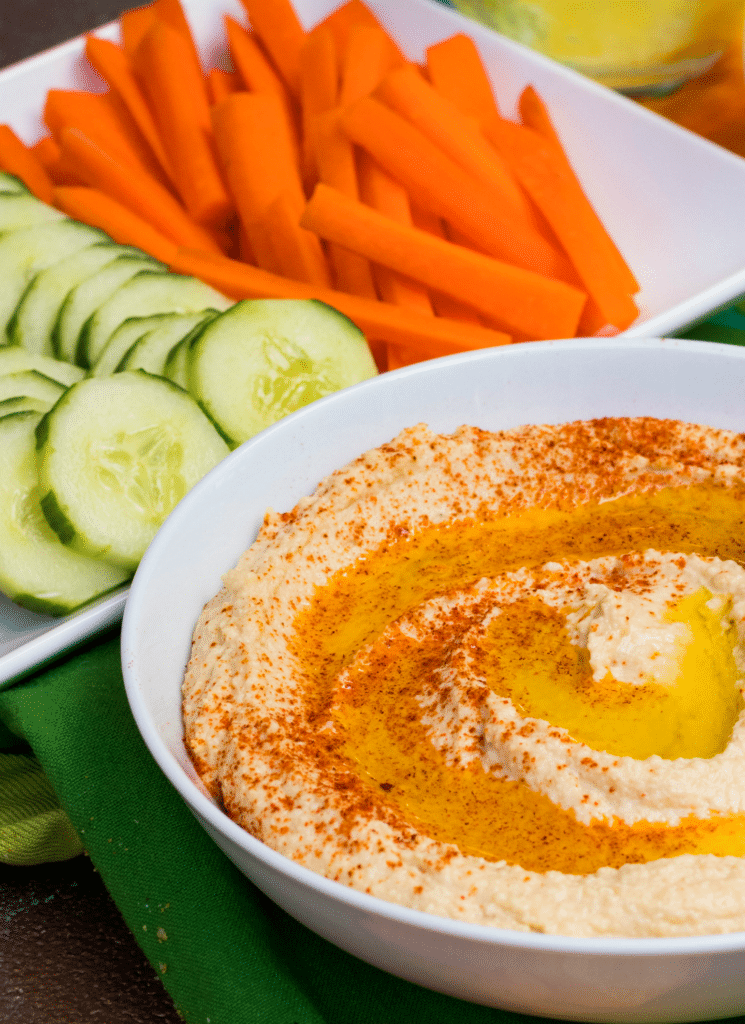 Homemade Roasted Garlic Hummus with a creamy texture is loaded with flavor and is the perfect dip to serve with pita chips or crunchy fresh veggies.