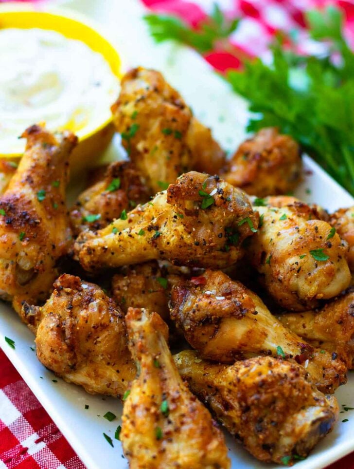 Air Fryer chicken wings are crispy, crunch and juicy. Made with chicken wings, Montreal Steak seasoning, garlic powder and salt. They are super yummy served with cool ranch dip and Texas Pete hot sauce.