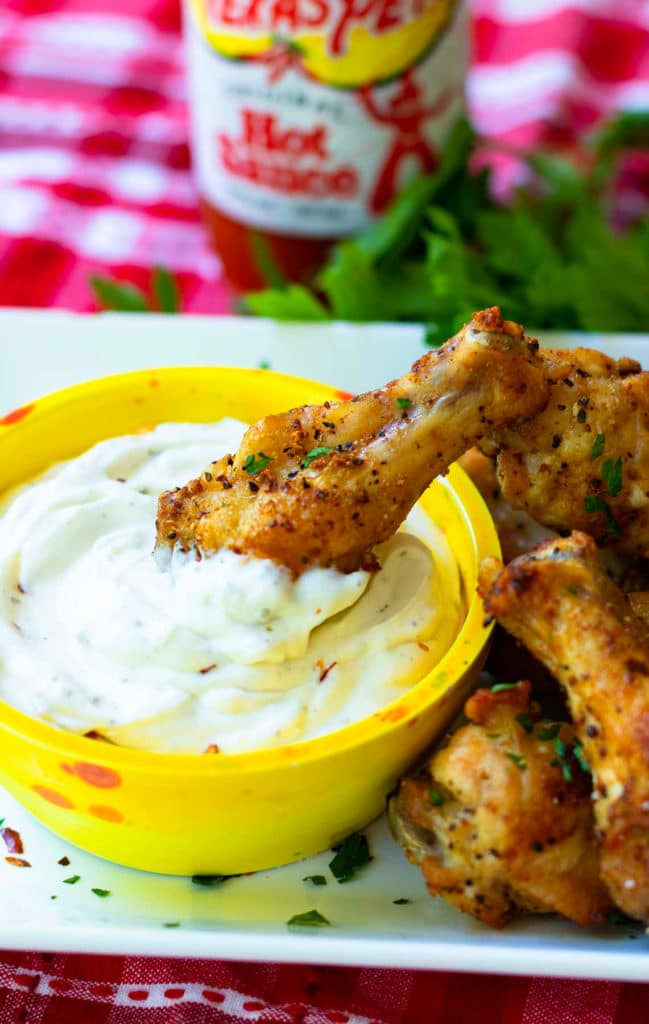 Air Fryer chicken wings are crispy, crunch and juicy. Made with chicken wings, Montreal Steak seasoning, garlic powder and salt. They are super yummy served with cool ranch dip and Texas Pete hot sauce.