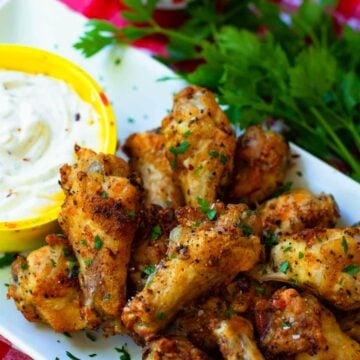 Air Fryer chicken wings are crispy, crunch and juicy. Made with chicken wings, Montreal Steak seasoning, garlic powder and salt. They are super yummy served with cool ranch dip and Texas Pete hot sauce.