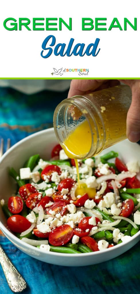 Green Bean Salad made with fresh bean, tomatoes, onions and feta cheese, tossed into a light lemony dressing is the perfect side dish for any meal!