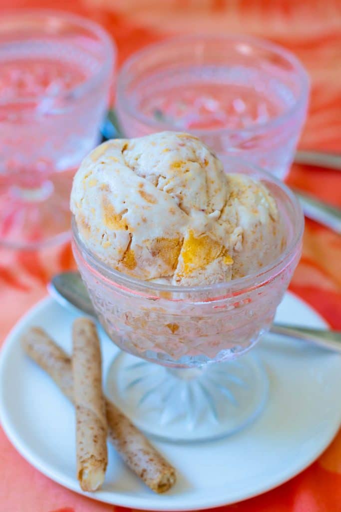 No Churn Peach Ice Cream made with fresh chopped peaches, whipped heavy cream, condensed milk, vanilla and a pinch of salt is delicious! It's sweet, creamy and no ice cream maker is required.