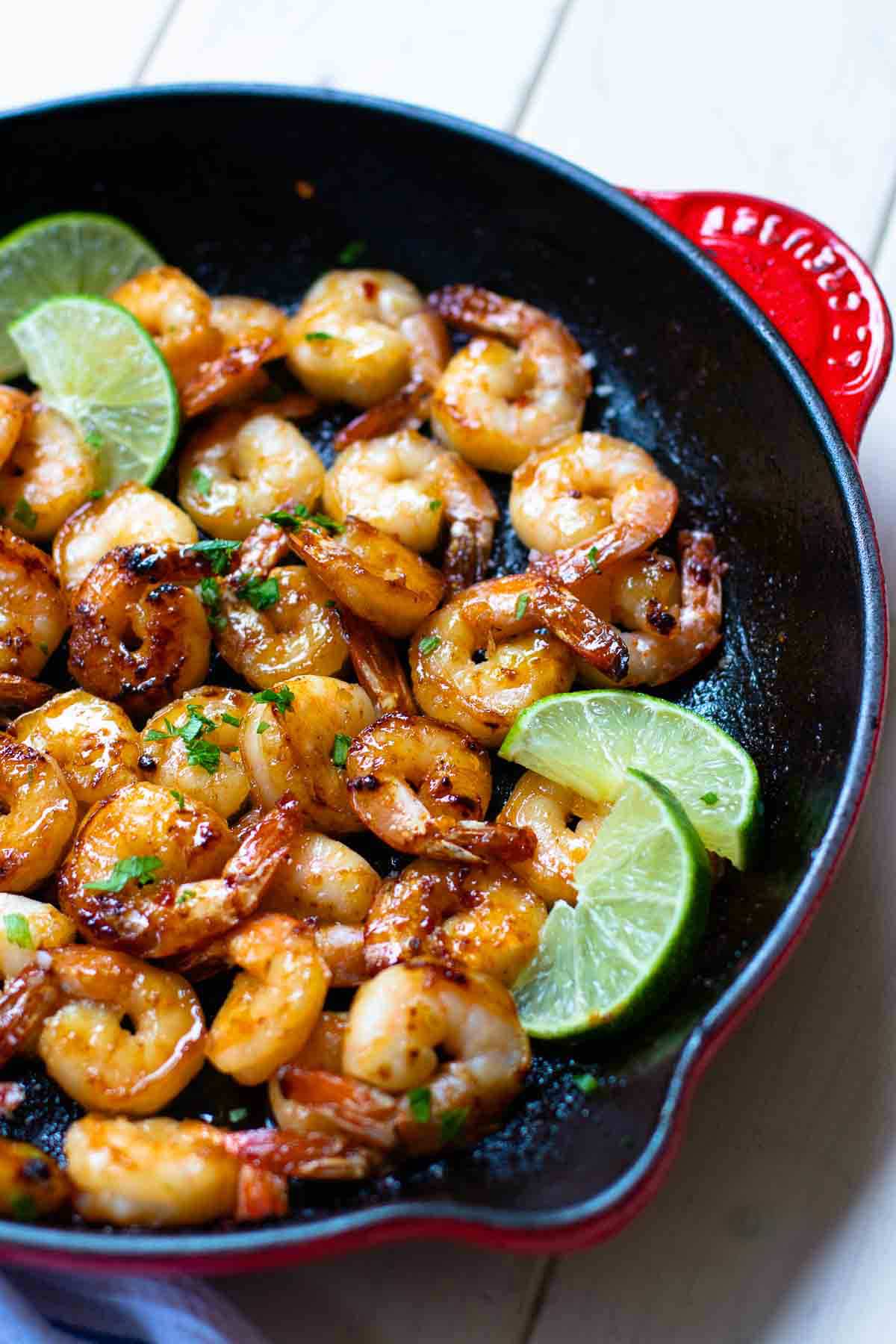 Garlic Honey Lime Shrimp are easy to make in just 15 minutes! Made with peeled, deveined shrimp, olive oil, red pepper flakes, salt, pepper, honey, and fresh lime juice. Perfect for an appetizer or a main dish.