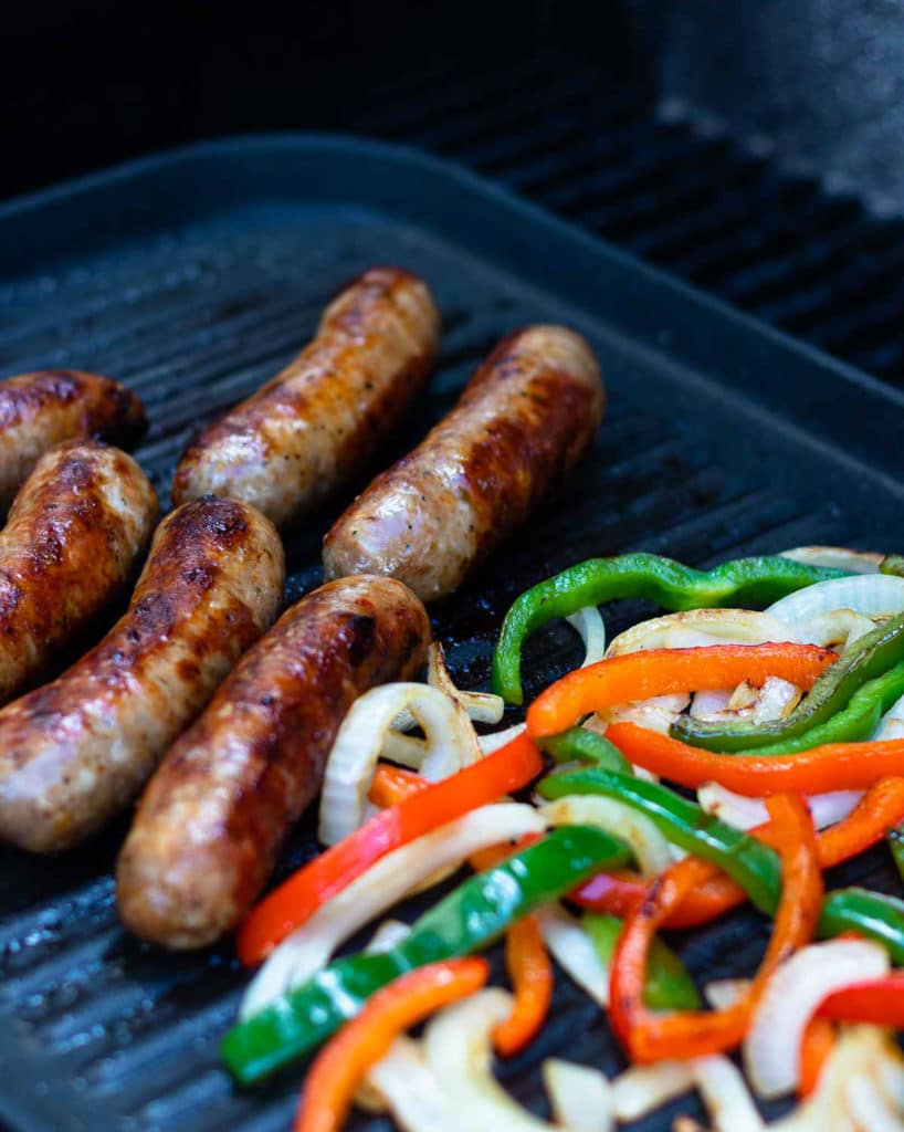 This classic combination of Grilled Sausage, Peppers and Onions is totally easy to make and delicious. Made with mild Italian sausage, sliced red and green bell pepper and yellow onions seasoned with salt and pepper and cooked on the grill.