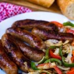 This classic combination of Grilled Sausage, Peppers and Onions is totally easy to make and delicious. Made with mild Italian sausage, sliced red and green bell pepper and yellow onions seasoned with salt and pepper and cooked on the grill.