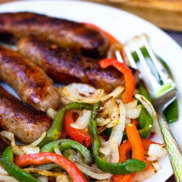 This classic combination of Grilled Sausage, Peppers and Onions is totally easy to make and delicious. Made with mild Italian sausage, sliced red and green bell pepper and yellow onions seasoned with salt and pepper and cooked on the grill.