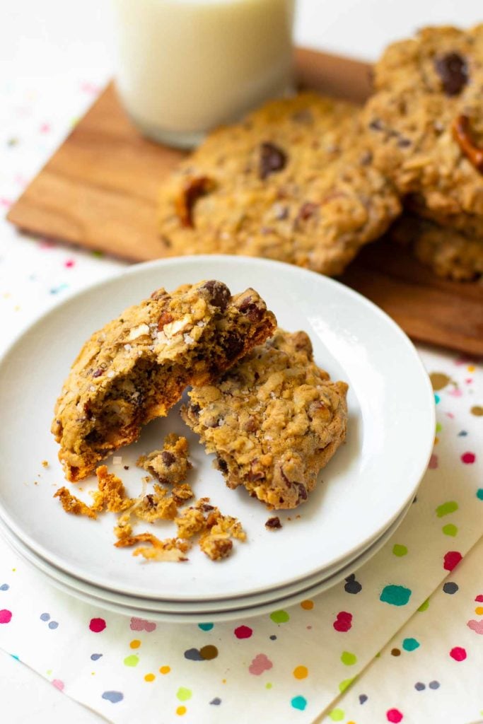 Kitchen Sink Cookies are loaded with sweet, savory and salty goodness! Made with butter, sugar, flour, oats, dark chocolate, chocolate chips, coconut, pecans and pretzels. This is one cookie that that has something for everyone!
