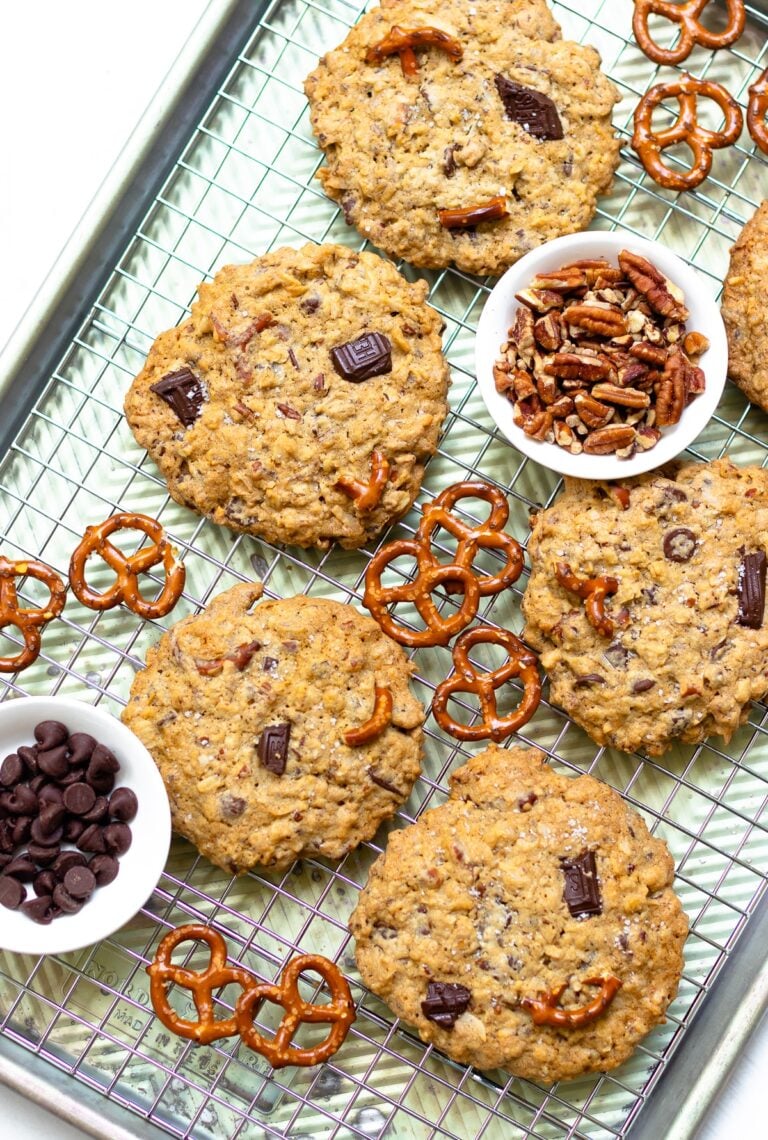 Kitchen Sink Cookies are loaded with sweet, savory and salty goodness! Made with butter, sugar, flour, oats, dark chocolate, chocolate chips, coconut, pecans and pretzels. This is one cookie that that has something for everyone!