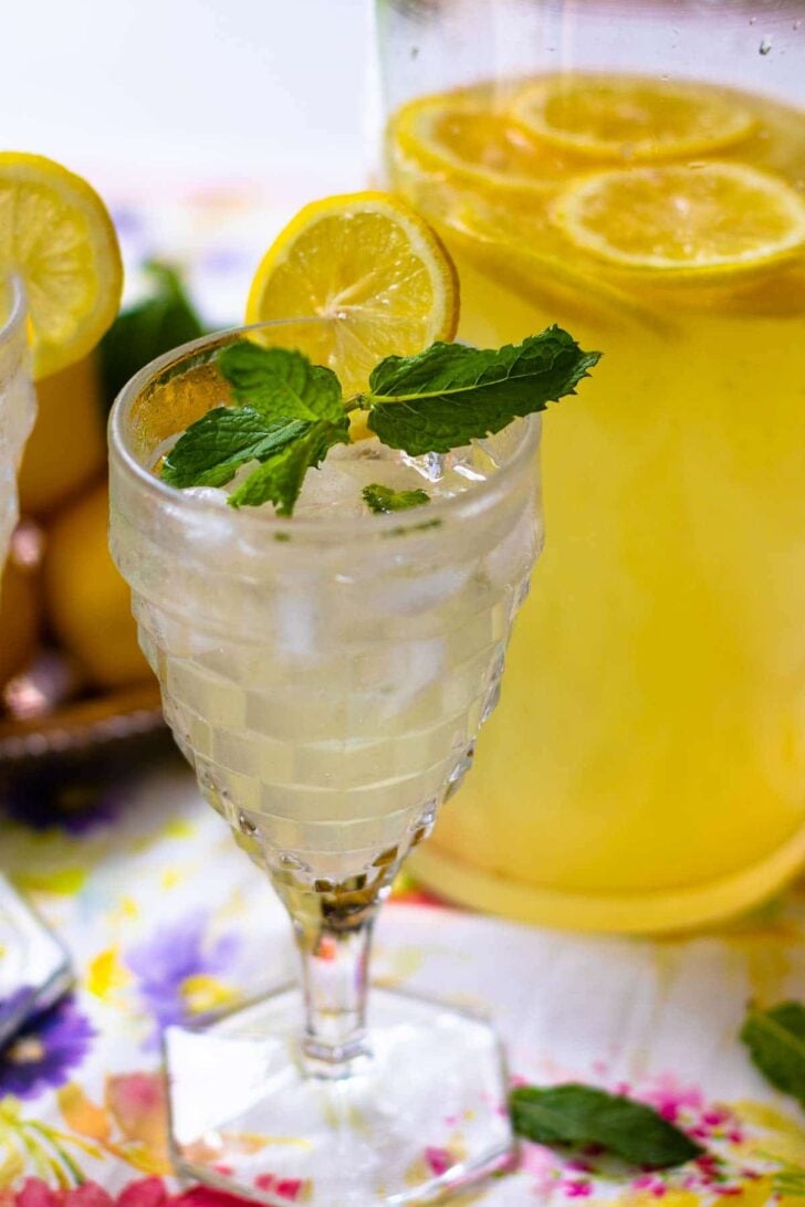 Homemade lemonade is refreshing and so easy to make. Fresh squeezed lemon juice sweetened with simple syryp made from sugar and water with a little water and poured over ice mades a delicious drink perfect for any time of the year.