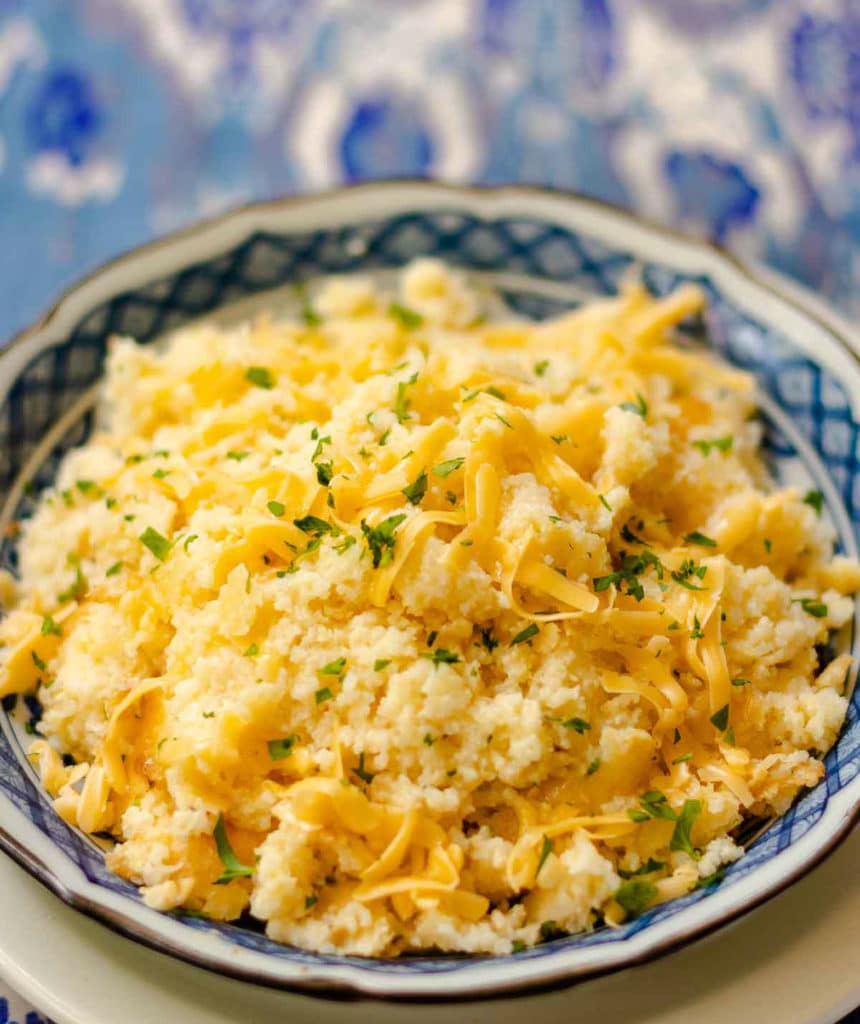 Smoked Gouda Cheese Grits Casserole is full of deep, rich flavors. Made with quick cooking grits, shredded smoked gouda cheese, butter, half and half, red pepper flakes and salt. The perfect side dish for grilled meats and fish or anytime you need the ultimate side dish.