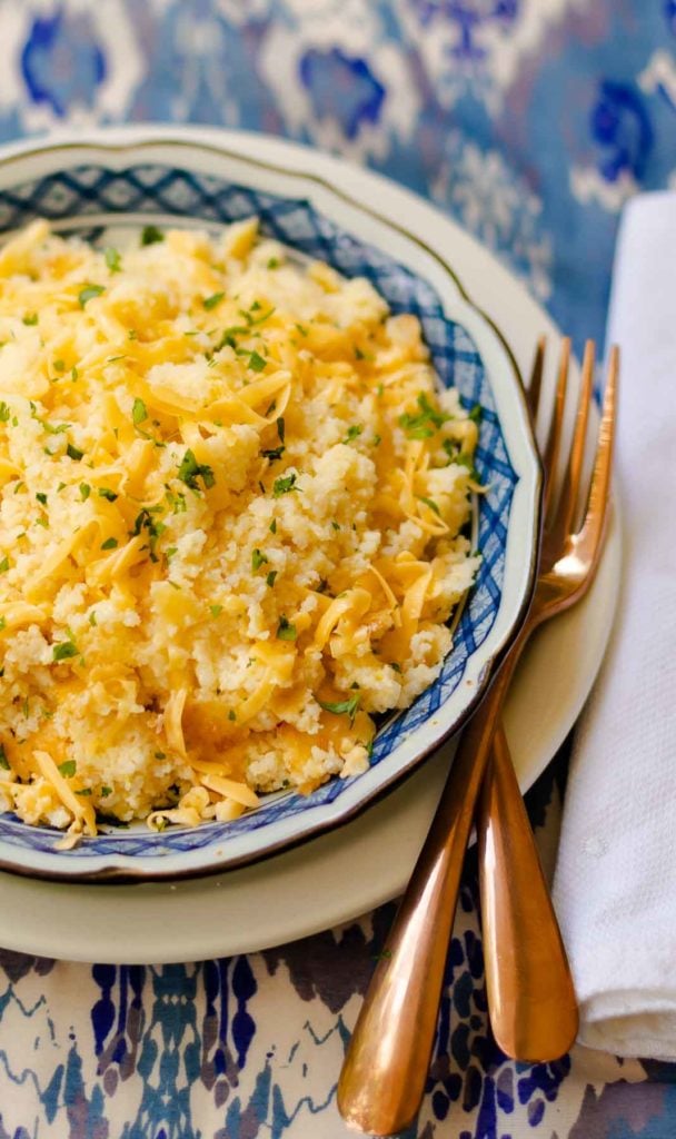 Smoked Gouda Cheese Grits Casserole is full of deep, rich flavors. Made with quick cooking grits, shredded smoked gouda cheese, butter, half and half, red pepper flakes and salt. The perfect side dish for grilled meats and fish or anytime you need the ultimate side dish.